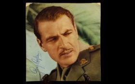 Gary Cooper Autograph presented on vintage photograph.