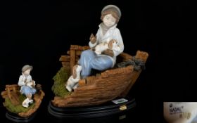 Nadal - Lladro Style Spanish Pottery Hand Painted Porcelain Figure - Young Boy Seated on a Fishing