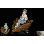 Nadal - Lladro Style Spanish Pottery Hand Painted Porcelain Figure - Young Boy Seated on a Fishing