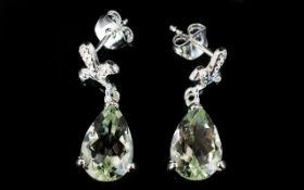 Green Amethyst Pear Drop Earrings, each earring comprising a 2.