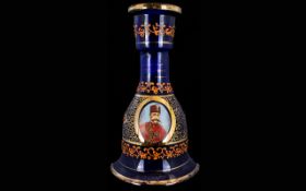 A Blue Glass Mallet Shaped Decanter With applied gilt decoration and portrait of Ottoman soldier to