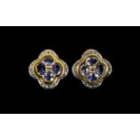 Tanzanite Pair of Quatrefoil Stud Earrings, the earrings having four round cut tanzanites of good