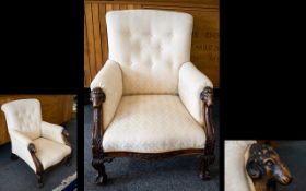 Ladies Button Back Low Armchair With carved rams head supports and claw feet.