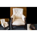Ladies Button Back Low Armchair With carved rams head supports and claw feet.