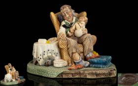 Stonecraft Handpainted Figure Group Titled 'Grandad's Darling' In the form of seated male figure