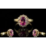 18ct Gold Diamond Dress Ring Set with central pink Sapphire gemstone, surrounded by twelve round cut
