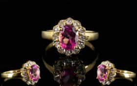 18ct Gold Diamond Dress Ring Set with central pink Sapphire gemstone, surrounded by twelve round cut