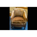 An Early 20th Century Brown Leather Tub Chair Of small proportions with drop in seat,