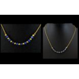 18ct Gold and Lapis Lazuli Beaded Necklace of Attractive Form. Marked 18ct. Contemporary Design.