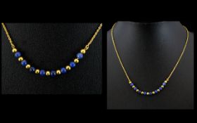 18ct Gold and Lapis Lazuli Beaded Necklace of Attractive Form. Marked 18ct. Contemporary Design.