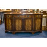 A 1980's Brake Front Mahogany Sideboard Comprising central drawer above and between storage