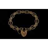 Superior Quality 9ct Gold Ornate Gate Bracelet with attached 9ct ornate heart shaped padlock and