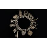 Silver Curb Bracelet - Loaded with 13 Good Quality Silver Charms with Attached Safety Chain and