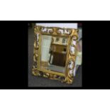 Bevelled Glass Mirror Large decorative mirror in ornate gilt swept reproduction rococo frame.