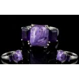 Russian Charoite and Amethyst Ring, a 5ct octagon cut cabochon of the unusual Russian stone,