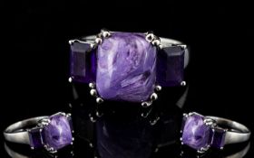 Russian Charoite and Amethyst Ring, a 5ct octagon cut cabochon of the unusual Russian stone,