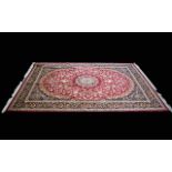 A Very Large Woven Silk Carpet Keshan rug with red ground and traditional Middle Eastern floral and