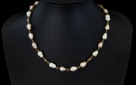 Fresh Water Pearl Necklace Silver gilt chain and clasp, length 16 inches.