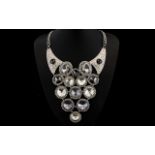 White and Grey Large Circular Crystal Statement Necklace, a dramatic, long V shaped necklace