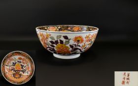 A Large Oriental Punch Bowl With Imari decoration to interior and exterior,