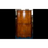 J Webster And Sons Ltd Yew Wood Drinks Cabinet Corner cabinet with serpentine front, panelled doors,