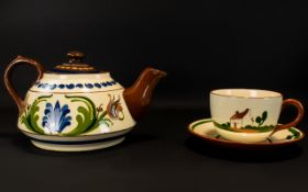 Oversized Cornish Slipware Teapot And Cup With Saucer A large teapot in traditional cream and brown