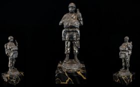 WWII Interest US Paratrooper Figure White metal figure raised on black marble base.