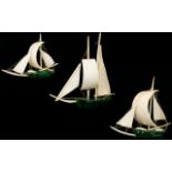 A Set Of Three Early 20th Century Malachite And Ivory Sailing Boats Each with solid malachite hulls
