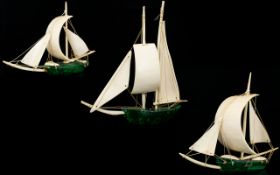 A Set Of Three Early 20th Century Malachite And Ivory Sailing Boats Each with solid malachite hulls