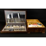 A Boxed Canteen Of Silver Plated Cutlery Of typical form in hinged display box - all pieces intact