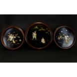 A Set Of Three Japanese Inlaid Panels Circular wall mounted panels, two depicting birds of prey on