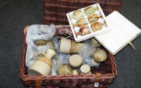 A collection of ceramics in a hamper to