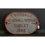 Antique Cast Iron Sign Oval form with raised lettering and red painted trim, marked 'T Woodall,