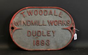 Antique Cast Iron Sign Oval form with raised lettering and red painted trim, marked 'T Woodall,