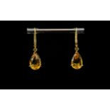 Citrine Pair of Drop Earrings, pear cut citrine solitaires, of rich honey colour, totalling 5cts,