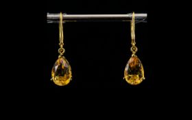 Citrine Pair of Drop Earrings, pear cut citrine solitaires, of rich honey colour, totalling 5cts,