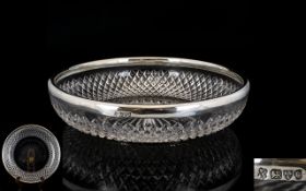 An Edwardian Cut Glass And Silver Fruit Bowl Shallow glass bowl with star base and cut glass band