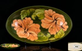 Moorcroft Deep Oval Shaped Footed Bowl ' Coral Hibiscus ' Design on Green Ground. c.1980's.