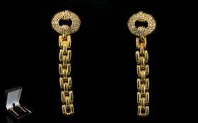 A Pair Of 18ct Gold And Diamond Set Drop Earrings Of stylised form with post and stud fastening.