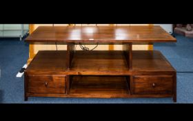 A Stained Beechwood Television Stand Two tier low table with two drawers and four apertures.