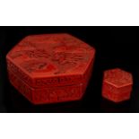 Two Oriental Cinnabar Boxes Each of hexagonal form,