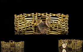 A Superb Quality 9ct Gold Gate Bracelet with Safety Chain and 9ct Gold Heart Shaped Padlock,