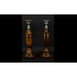 A Pair of 1920's Turned Oak Candlesticks Each with silver plated drip trays,