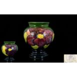 William Moorcroft Small Tubelined Urn-shaped Vase 'Clematis' on Green Ground.