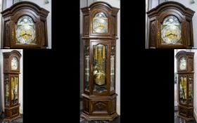 A Modern Triple Weighted Oak Howard Longcase Clock with a silver chapter dial, Roman Numerals,