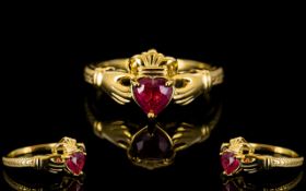 Ruby Solitaire Claddagh Ring, the traditional Claddagh style shows a 1ct heart cut ruby,