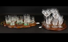 Two Mid 20th Century Drinks Trays With Accompanying Glasses The first,