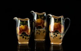 Rubian Art Pottery Set Of Three Lustre Jugs Each of stylised square form in descending height,