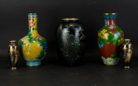 Two Oriental Cloisonne Vases Each decorated with traditional floral and foliate designs with