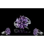 Amethyst Diagonally Set Cluster Ring, 10 oval cut amethysts, totalling 3cts,